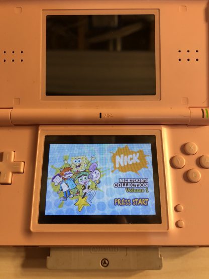 Nintendo DS Lite with Game Boy Advance game Nicktoon's Collection Volume 1