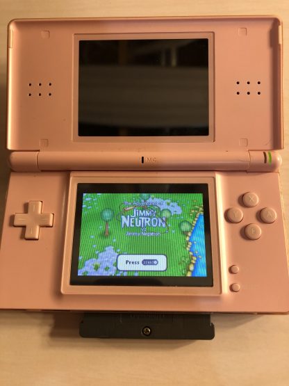 Nintendo DS Lite with Game Boy Advance game The Adventures of Jimmy Neutron Boy Genius in Jimmy Negatron